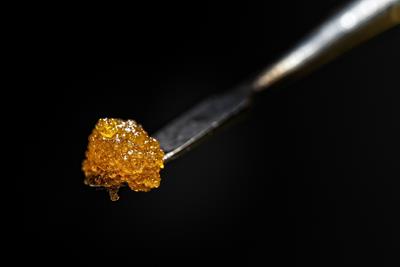 A "dab" of concentrate on the end of a titanium dabbing tool
