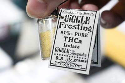 Image of a jar of THCA labeled as Giggle Frosting