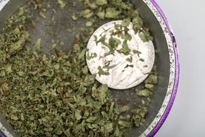 Grinder coin in a cannabis grinder