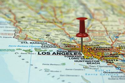 A map of Los Angeles that has all the cities named and has a red push pin right on top of LA. 